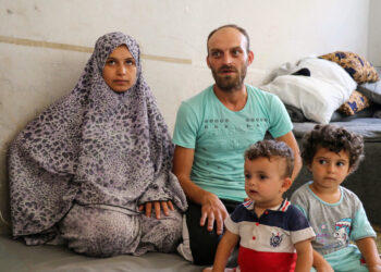 After 8 months following the earthquake, a family awaits the arrival of their newborn in a shelter center