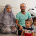 After 8 months following the earthquake, a family awaits the arrival of their newborn in a shelter center